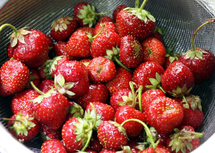 strawberries in a colander