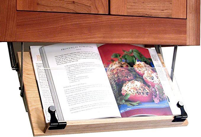 A cookbook holder that folds out from under a cabinet.