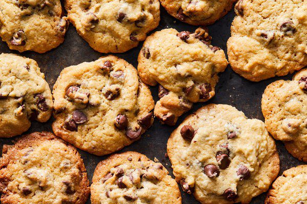 Closeup of several golden brown chocolate chip cookies.